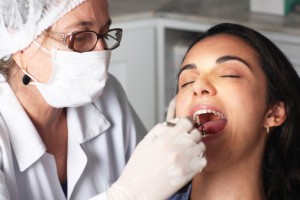 Dentist checking the girl