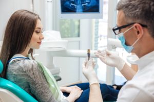 Dentist explaining to a lady patient