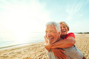 Senior couple having fun on the beach