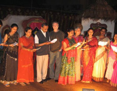 Dr. Arnold joins the group of dentists singing traditional Indian songs at the party in Bangalore.