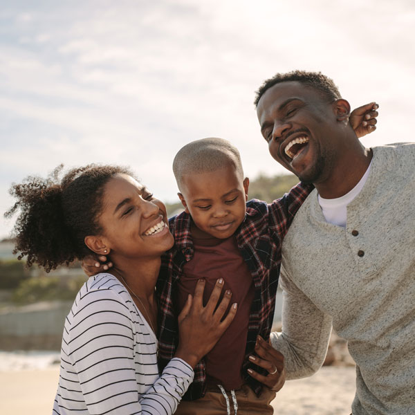 laughing family of three